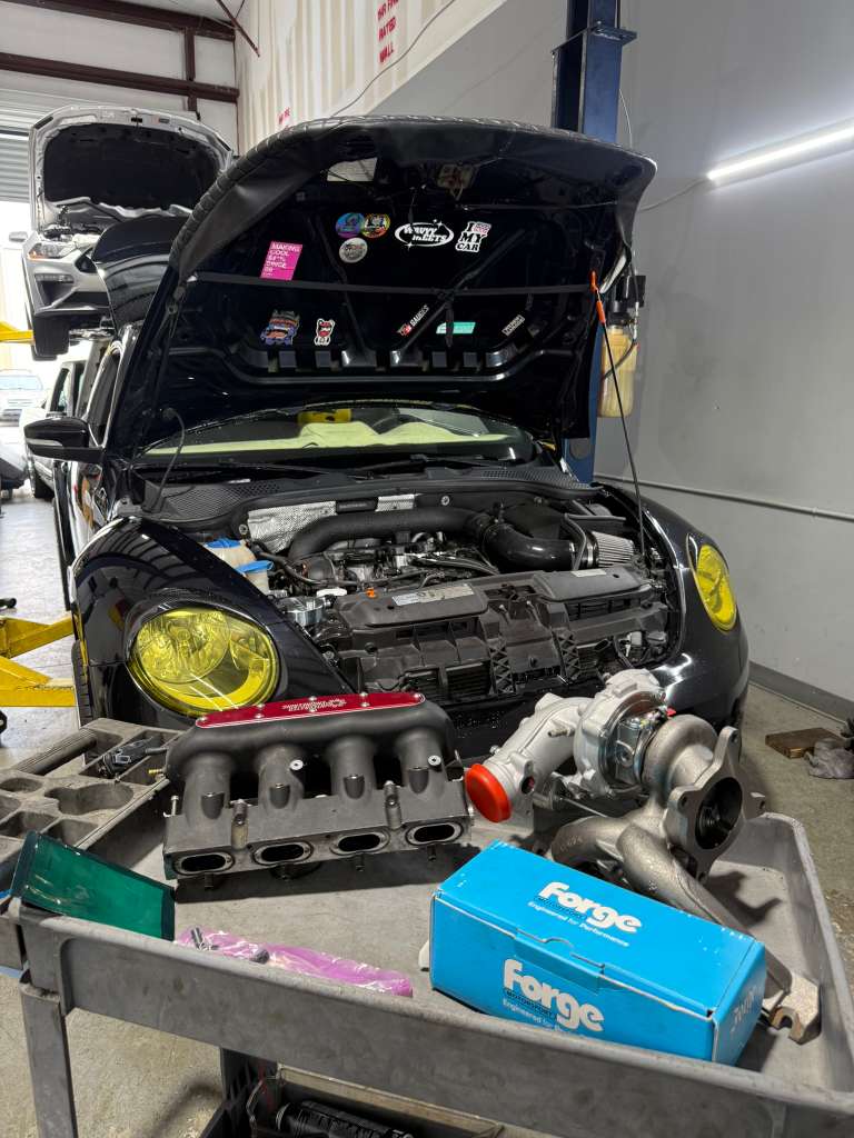 Performance car undergoing shop diagnostics