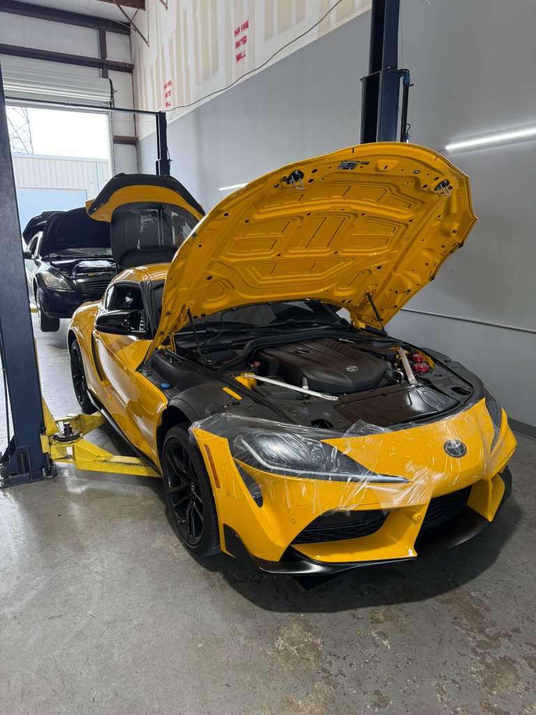 Yellow sports car in the Mapgreen workshop